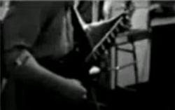 Einar playing guitar in UVC 1983